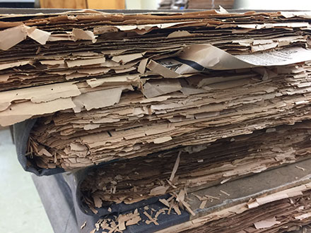 Side view of deteriorating newspapers